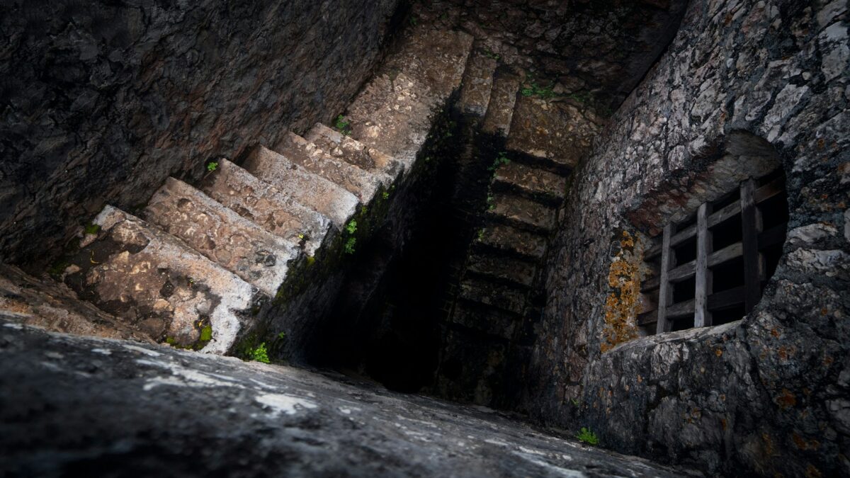 A set of stone stares descending.