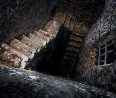 A set of stone stares descending.